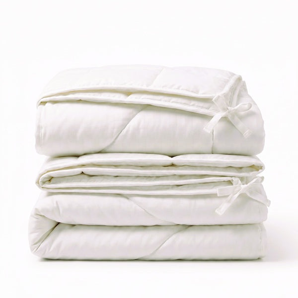 Stack of white moemoe combo duvets on a white background